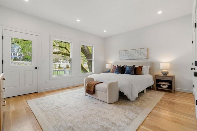 bedroom with light wood finished floors, baseboards, and recessed lighting