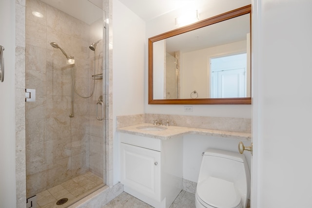 bathroom featuring walk in shower, vanity, and toilet