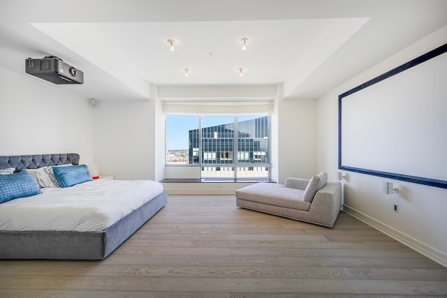 bedroom with hardwood / wood-style floors