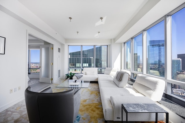 carpeted living room with a healthy amount of sunlight