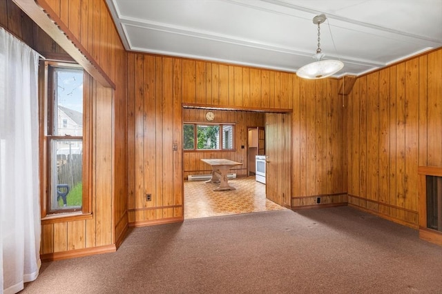 300-302 Main St, Gloucester, MA 01930 - unfurnished dining area with wood walls and a baseboard radiator