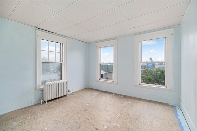 300-302 Main St, Gloucester, MA 01930 - unfurnished room with radiator, a paneled ceiling, and plenty of natural light