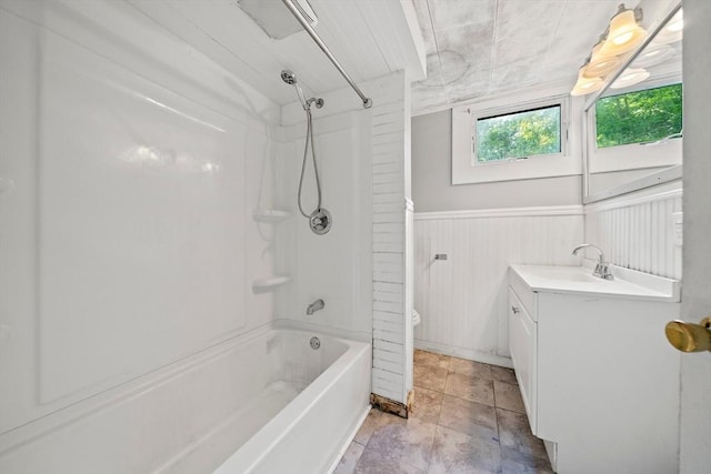 32 Standish Ave, Plymouth, MA 02360 - bathroom with shower / tub combination, vanity, and a wainscoted wall