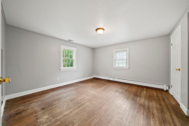 32 Standish Ave, Plymouth, MA 02360 - spare room featuring a baseboard heating unit and hardwood / wood-style floors