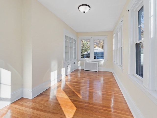 unfurnished sunroom with radiator