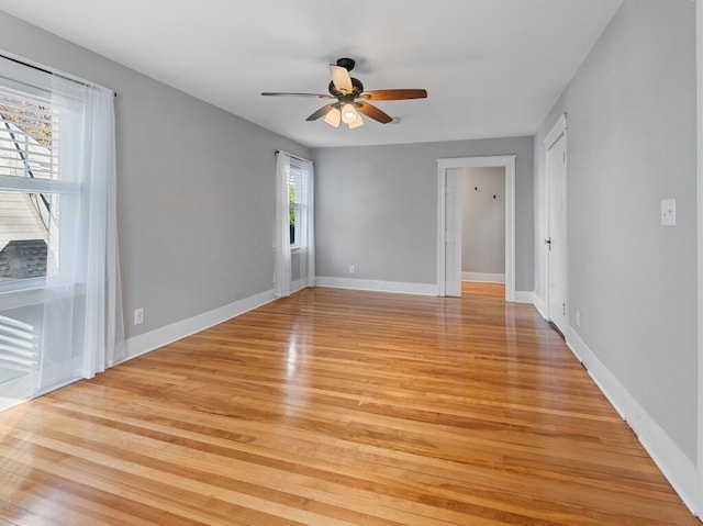 unfurnished room with ceiling fan and light hardwood / wood-style floors