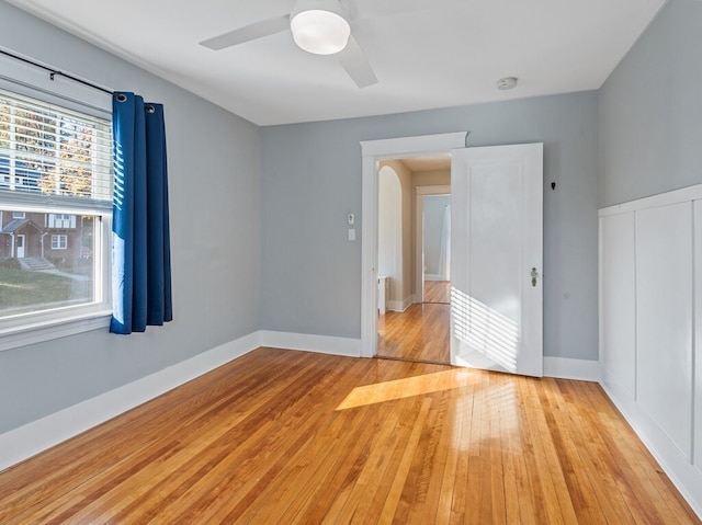 unfurnished room featuring ceiling fan and light hardwood / wood-style floors