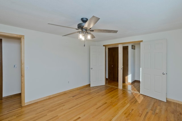 unfurnished bedroom with light hardwood / wood-style floors and ceiling fan