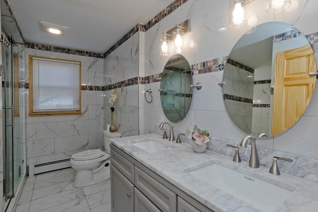 bathroom with vanity, a shower with door, toilet, tile walls, and a baseboard radiator