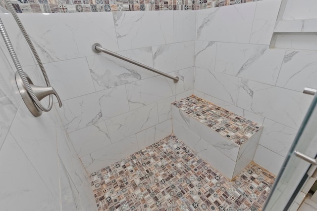 bathroom featuring tiled shower