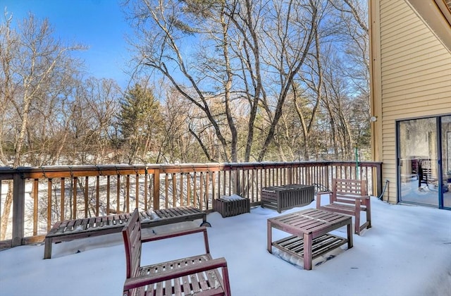 view of snow covered deck