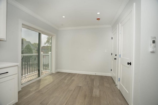 interior space with crown molding, baseboards, recessed lighting, and light wood-type flooring