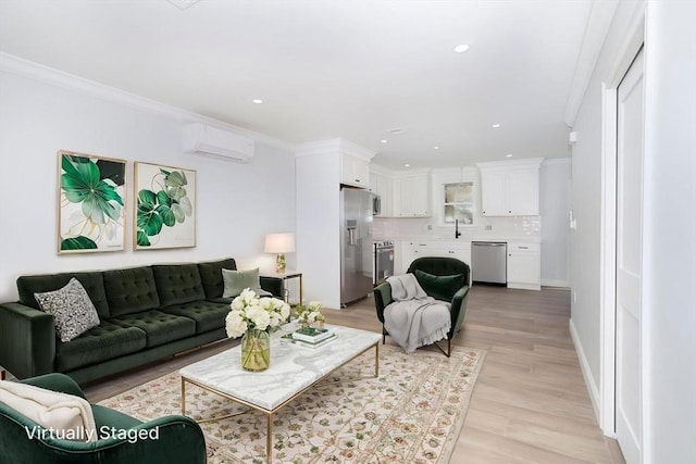 living room with light wood-style floors, ornamental molding, recessed lighting, and a wall mounted air conditioner