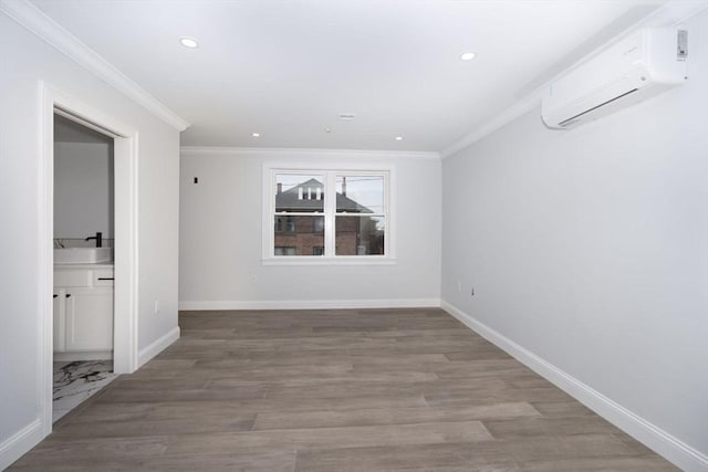 spare room with crown molding, an AC wall unit, and recessed lighting