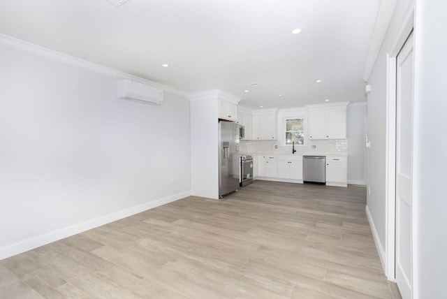 unfurnished living room with light wood-style floors, a sink, a wall mounted AC, and ornamental molding