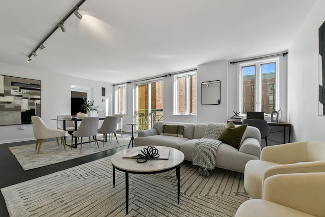 living room with track lighting and a healthy amount of sunlight