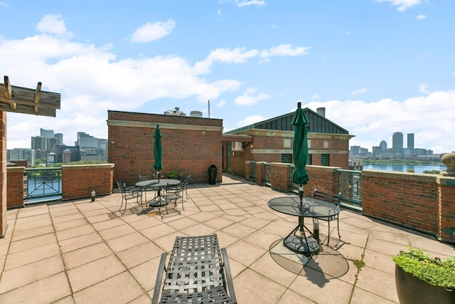 view of patio featuring a water view