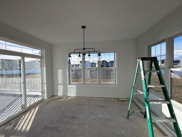 unfurnished dining area with a healthy amount of sunlight