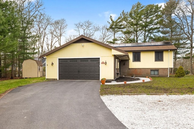 11 Michael Rd, Bourne, MA 02559 - tri-level home featuring an attached garage, driveway, a front yard, and solar panels