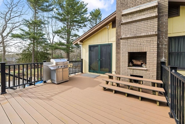 11 Michael Rd, Bourne, MA 02559 - wooden terrace with a fireplace and a grill
