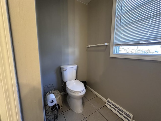 bathroom featuring tile patterned floors, baseboards, toilet, and visible vents