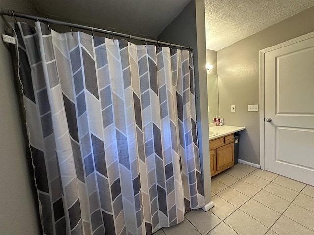 full bathroom featuring vanity, tile patterned floors, and a shower with curtain