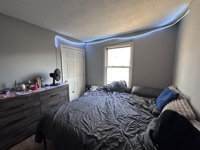 bedroom featuring a textured ceiling