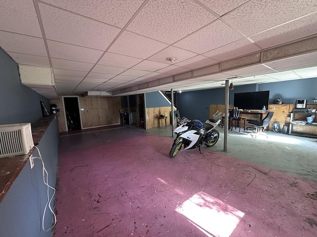 finished below grade area with a paneled ceiling