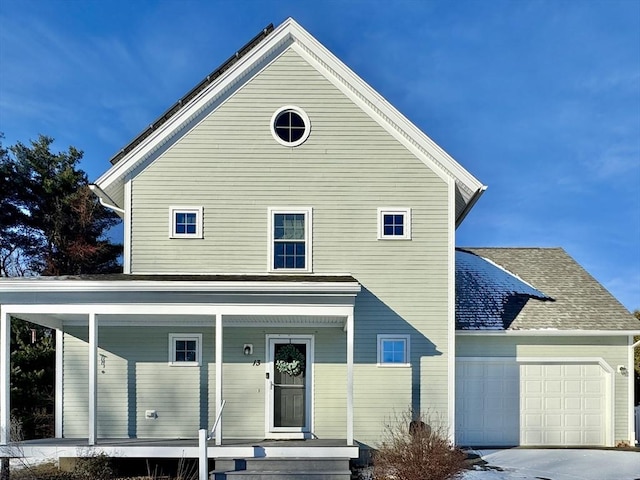 view of front of home with a porch and a garage