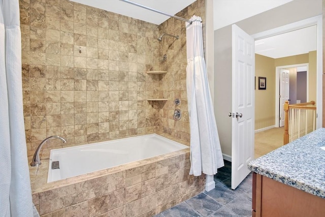 bathroom featuring vanity and shower / bath combo