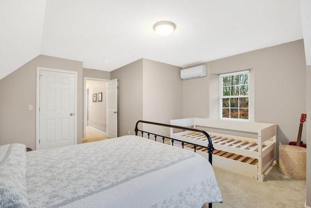 carpeted bedroom with vaulted ceiling and a wall unit AC