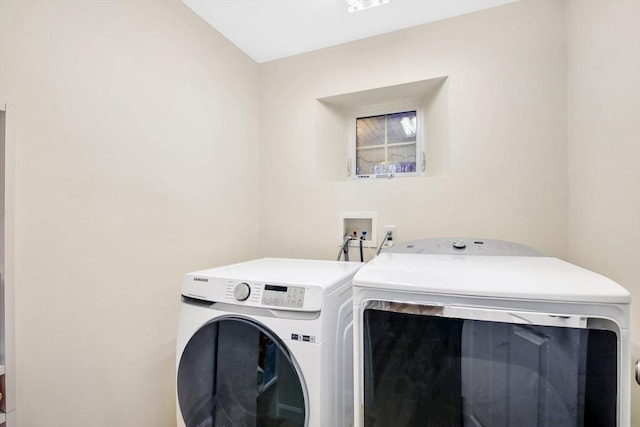 washroom featuring washing machine and dryer