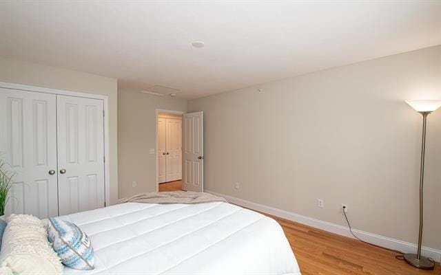 41 Winchester Unit 0, Hampstead, NH 03826 - bedroom with baseboards, light wood-type flooring, and a closet