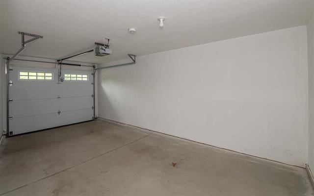 41 Winchester Unit 0, Hampstead, NH 03826 - garage featuring a garage door opener