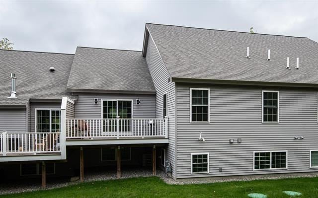 41 Winchester Unit 0, Hampstead, NH 03826 - rear view of property with a wooden deck, a lawn, and a shingled roof