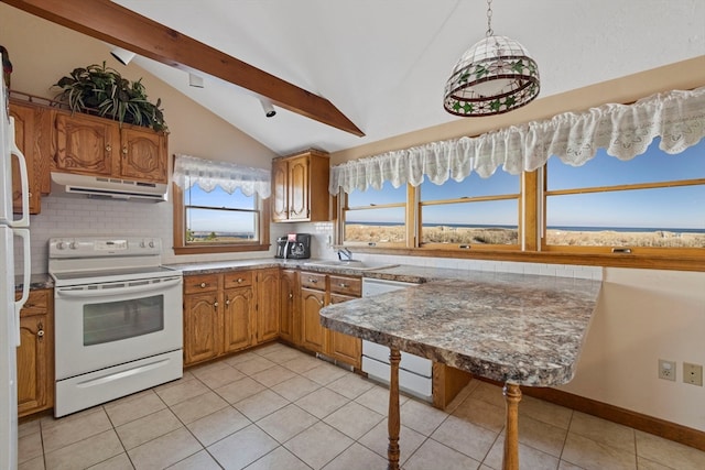 kitchen featuring tasteful backsplash, pendant lighting, lofted ceiling with beams, and white appliances