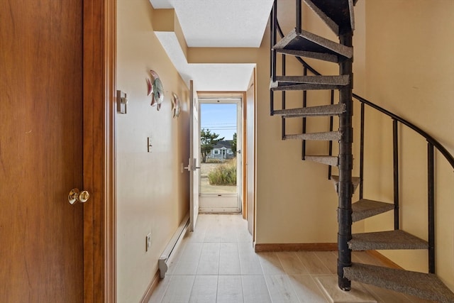 entryway featuring baseboard heating