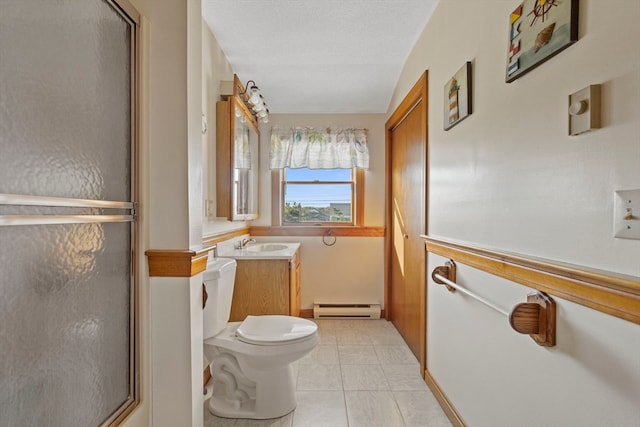 bathroom featuring a shower with door, vanity, a baseboard radiator, and a textured ceiling