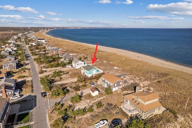 aerial view with a water view and a view of the beach