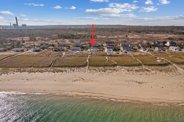 bird's eye view featuring a water view and a view of the beach