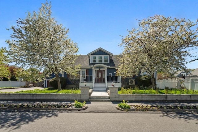bungalow-style home featuring a fenced front yard