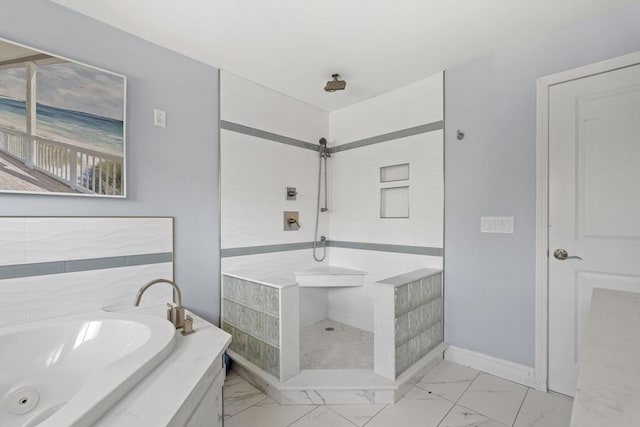 bathroom featuring baseboards, a tile shower, a garden tub, and marble finish floor