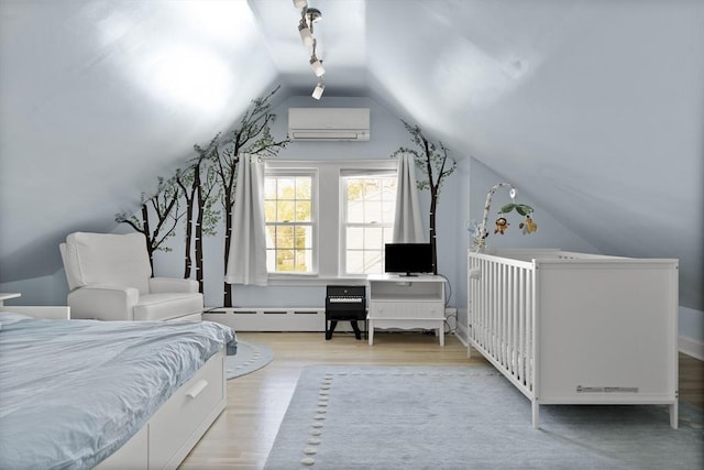bedroom featuring a wall mounted air conditioner, a baseboard radiator, wood finished floors, and vaulted ceiling