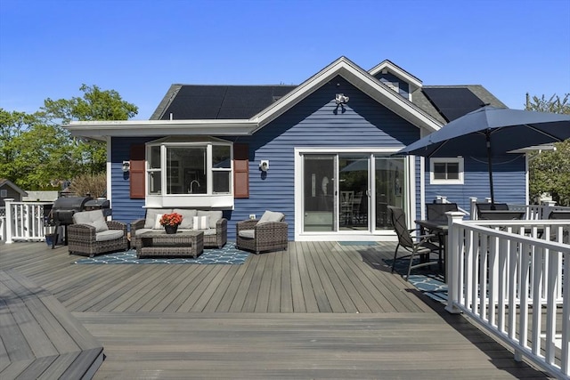 wooden deck featuring outdoor dining area, area for grilling, and outdoor lounge area