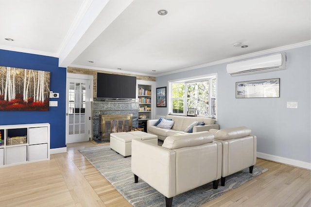 living area with crown molding, a wall mounted AC, and light wood-type flooring