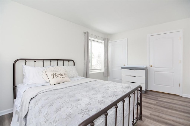 bedroom featuring wood-type flooring