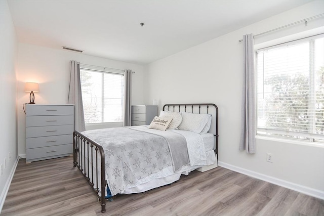 bedroom featuring wood-type flooring