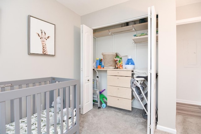 carpeted bedroom with a crib