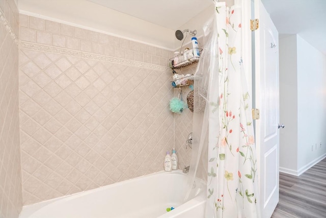 bathroom featuring shower / bath combo and wood-type flooring