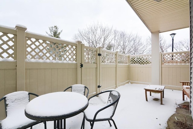 view of snow covered patio